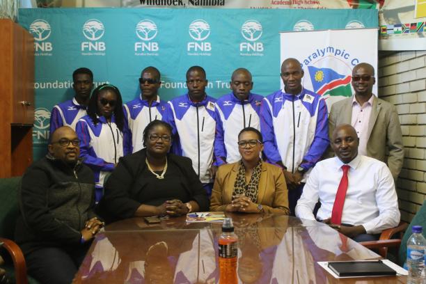Namibia investment a group of Para athletes and officials pose for a photo