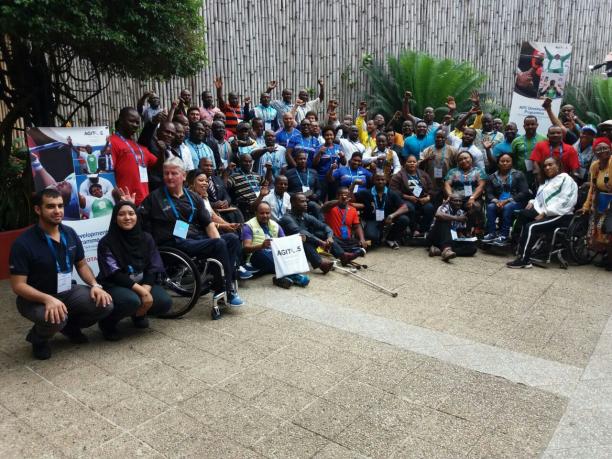 Nigeria Para powerlifting workshop a group of people wave at the camera