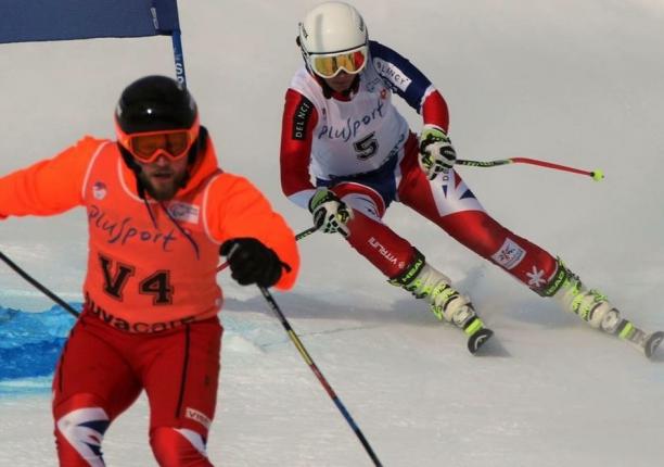 Millie Knight A Para skiier and her guide ski down the slope