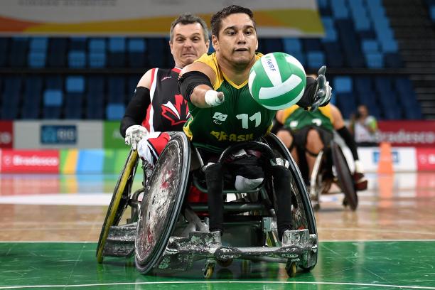 A wheelchair rugby player chasing for the ball