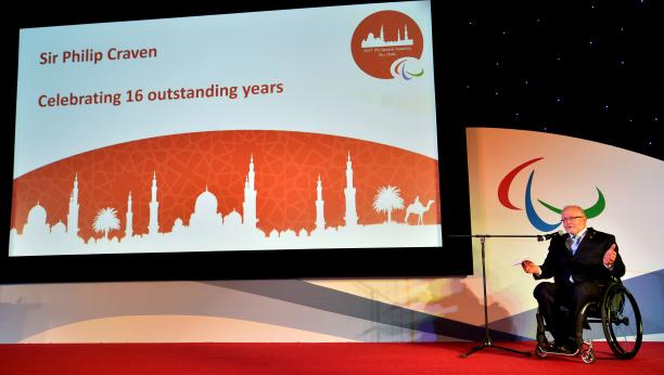 Sir Philip Craven - 2017 General Assembly a man in a wheelchair speaks in front of a screen on a stage