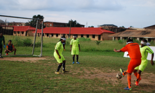 A group of blind female footballers playing 
