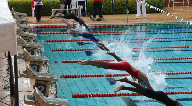 Kenya swimming champs a group of Para swimmers dive into a pool