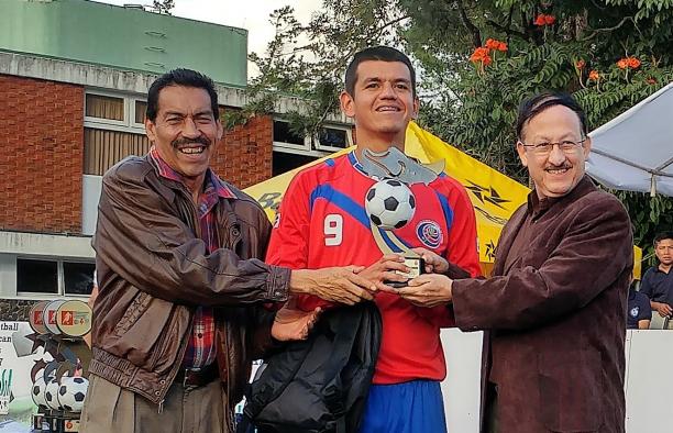 Esteban Chavez a blind footballer with his trophy
