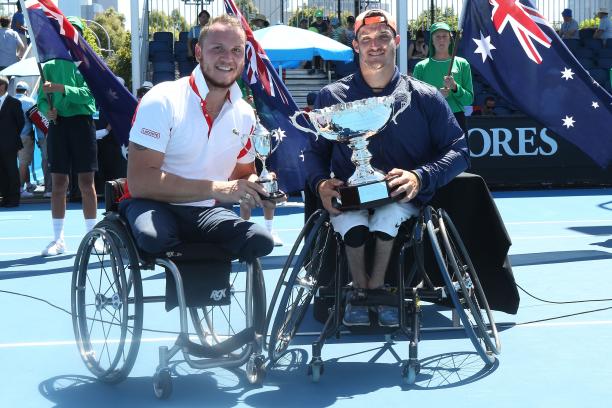 Nicolas Peifer and Gustavo Fernandez two male wheelchair tennis players hold up their trophies