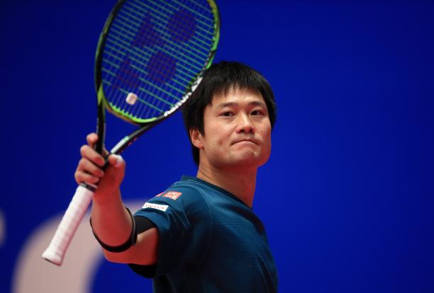Shingo Kunieda a male wheelchair tennis player holds up his racket