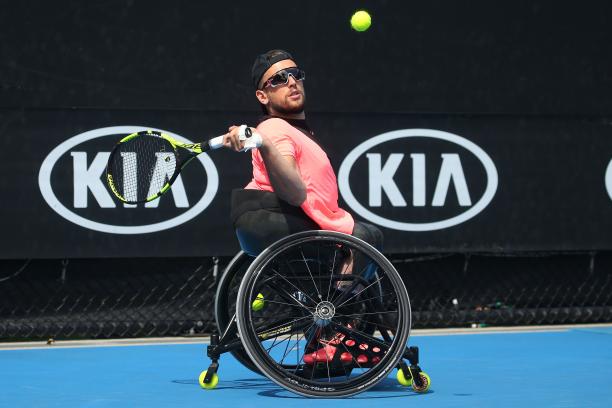 Dylan Alcott - Australian Open 2018 a male quad tennis player takes a shot