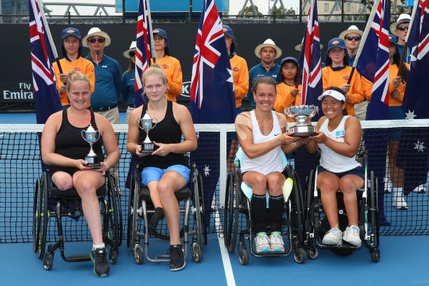 Women's doubles final - Australian Open 2018 four female wheelchair tennis players hold up their trophies on court
