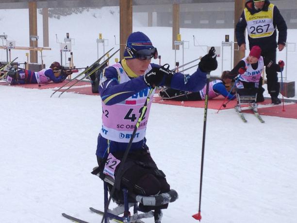 Athlete on a sit skiing racing