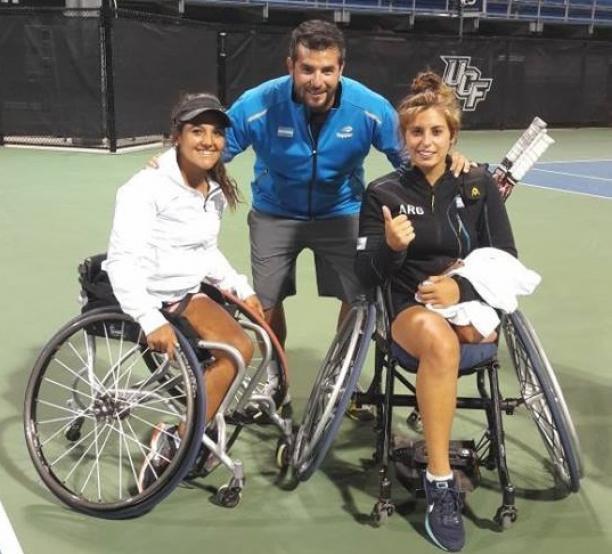 two female wheelchair tennis players with their coach