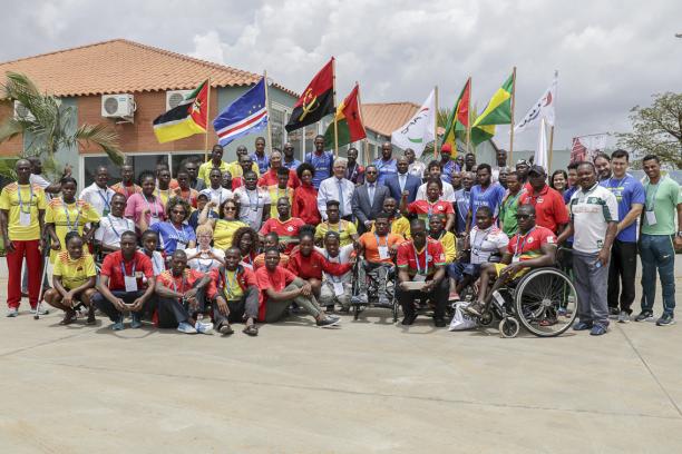 Around 50 participants of Agitos Foundation training camp pose for a group picture in Luanda, Angola