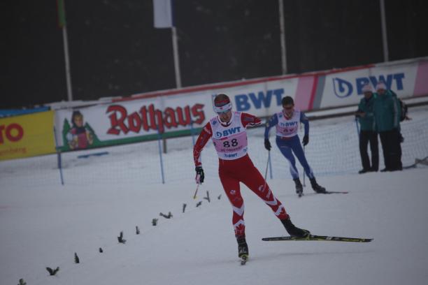 Mark Arendz - Oberried 2018 a male biathlete skies towards the finish line