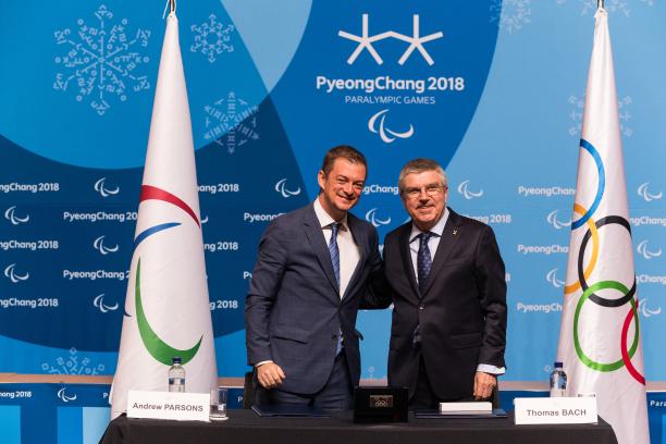 Andrew Parsons and Thomas Bach two men standing and smiling