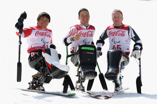Andrew Kurka - PyeongChang 2018 three male sit skiers celebrating on the snow