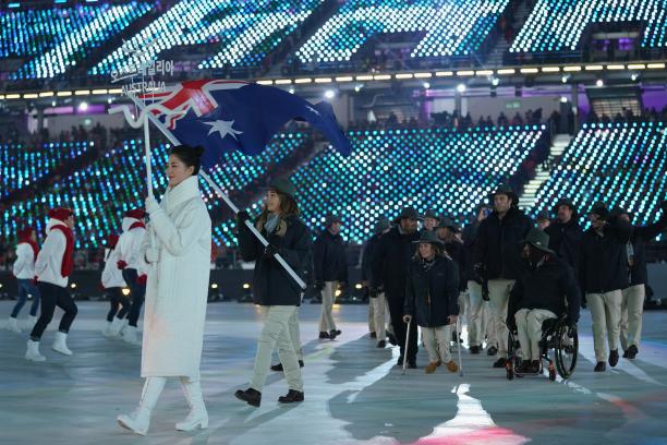 Joany Badenhorst - PyeongChang 2018 a female snowboarder carrying the flag of Australia