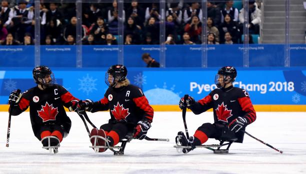 Canada beat Norway - PyeongChang 2018 a group of Para ice hockey players celebrate on the ice