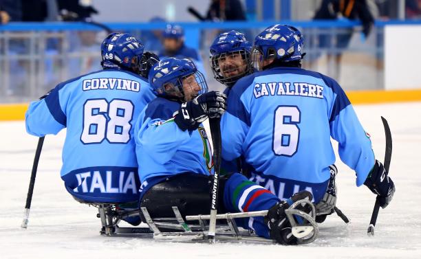 Italy beat Sweden - PyeongChang 2018 a group of Para ice hockey players celebrate on the ice