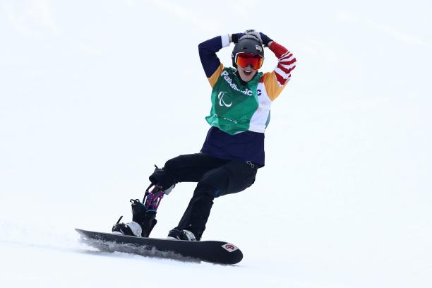 Brenna Huckaby - PyeongChang 2018 a female Para snowboarder celebrates on the snow