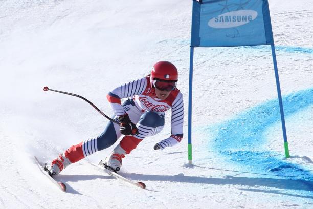Marie Bochet - PyeongChang 2018 a female Para skier rounds a gate