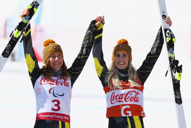 Henrieta Farkasova - PyeongChang 2018 a female vision impaired skier and her guide raise their arms in celebration