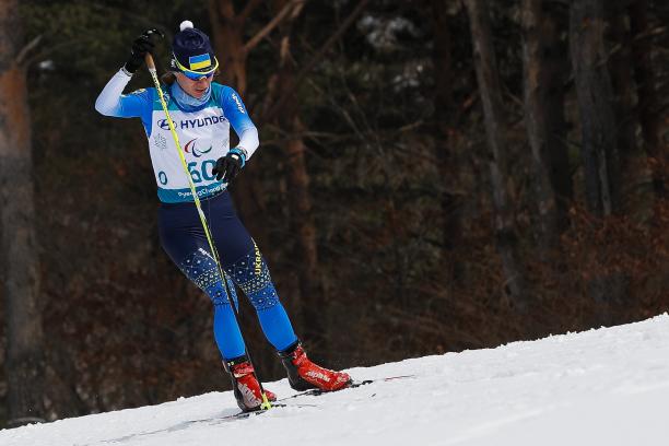 a female standing Nordic skier