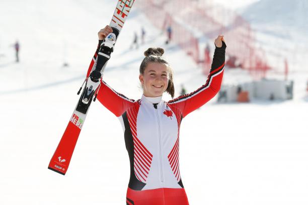Mollie Jepsen - PyeongChang 2018 a female Para skier raises her arms in celebration
