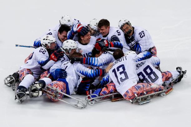 USA win ice hockey gold - PyeongChang 2018 a group of Para ice hockey players in a heap on the ice