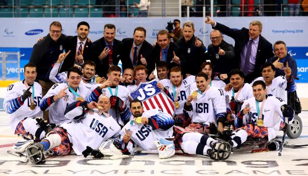 USA gold - PyeongChang 2018 a group of Para ice hockey players celebrate with their gold medals