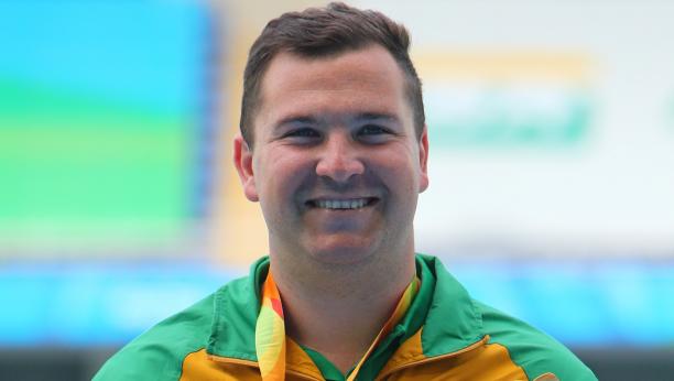 Reinhardt Hamman - Rio 2016 a male athlete smiling on the podium