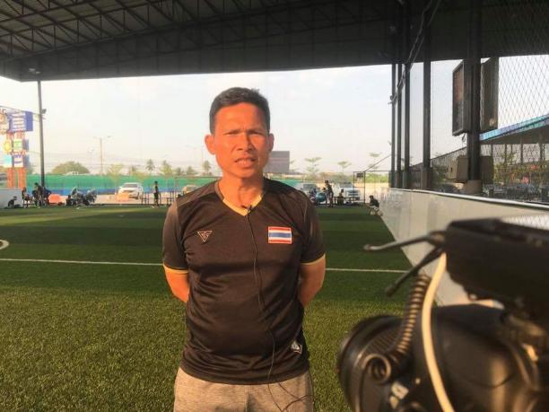 Prajak Ritnuch - Thailand blind football coach a man standing in front of a football pitch