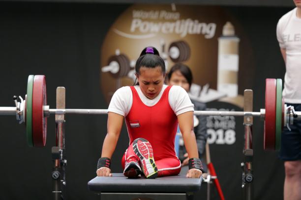 Ni Nengah Widiasih - Berck-Sur-Mer 2018 a female powerlifter prepares to lift by sitting on the bench