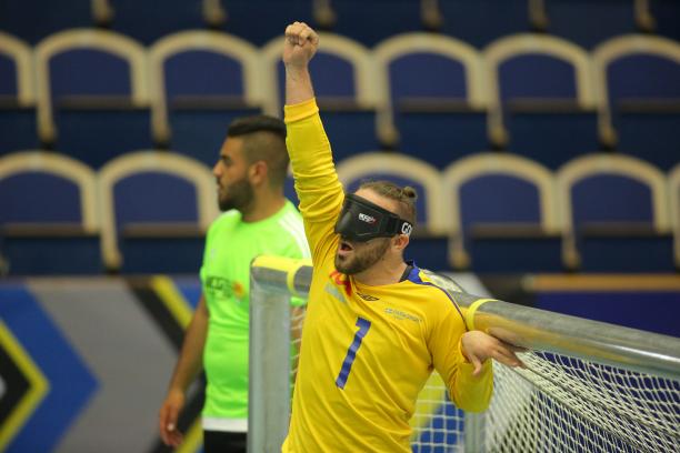 Sweden men - Malmo 2018 goalball a male goalball player punches the air in celebration