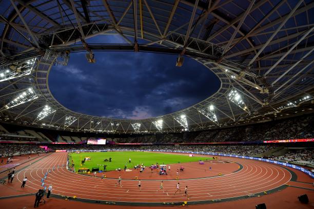 a wide shot of an athletics stadium at night