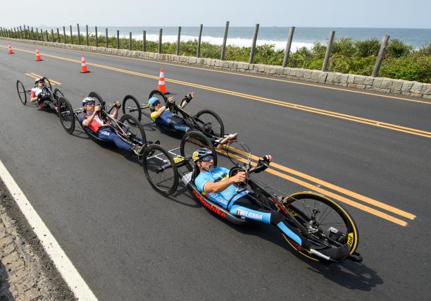 Rio 2016 men's road cycling a group of male Para cyclists race along the road
