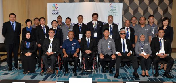 Asian Paralympic Committee Executive Board a group of men and women in a boardroom smiling at the camera