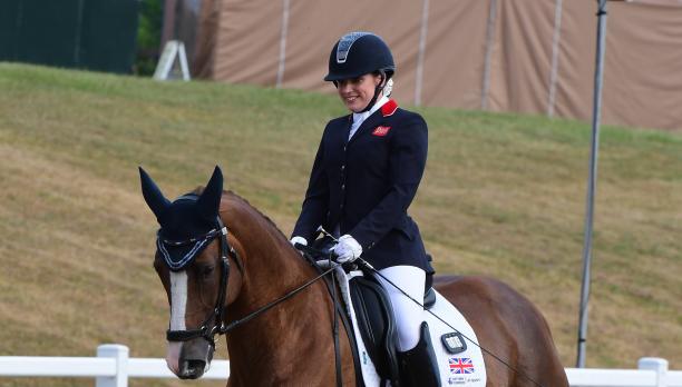female Para equestrian rider Natasha Baker smiles on her horse