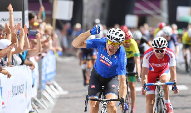 Michele Pittacolo - cycling - Maniago 2018 male Para cyclist Michele Pittacolo punches the air as he crosses the finish line