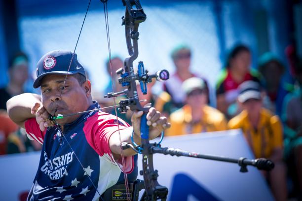 male Para archer Andre Shelby prepares to shoot an arrow