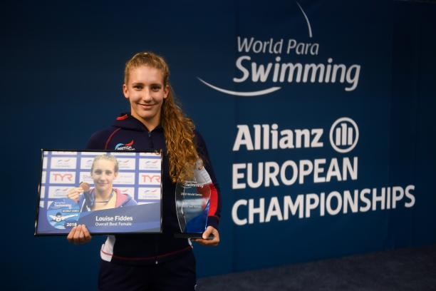 Louise Fiddes - World Series trophy - Dublin 2018 female Para swimmer Louise Fiddes smiling and holding two trophies