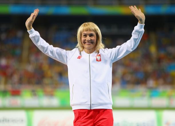Barbara Niewiedzial female Para sprinter Barbara Niewiedzial raises her arms on the podium