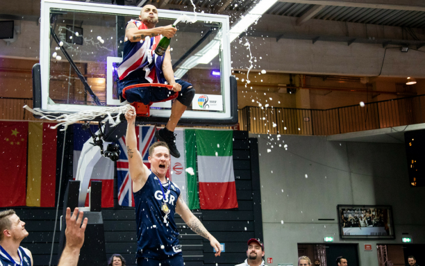 Great Britain - Wheelchair Basketball World Championships 2018 - Hamburg One man on the top a basketball hoop celebrating with another man under him