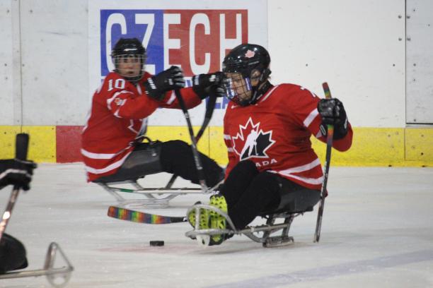 Canada women's ice hockey two female Canadian Para ice hockey players on the ice