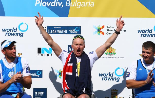 Erik Horrie - Australia - 2018 Para rowing World Championships - Plovdiv, Bulgaria A man in a wheelchair celebrating in the middle of two men in wheelchair chairs clapping