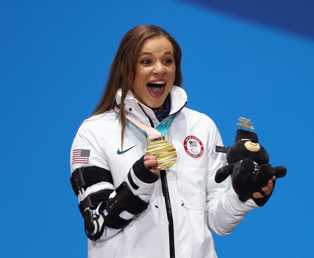 Oksana Masters - PyeongChang 2018 a female Para athlete holds up her gold medal and her mascot