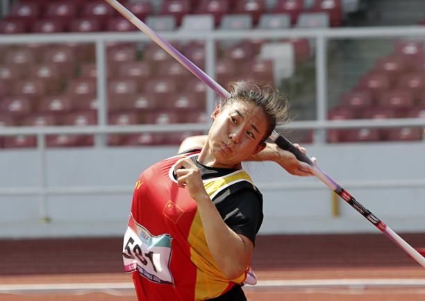 female Para athlete Zhao Yuping throws a javelin