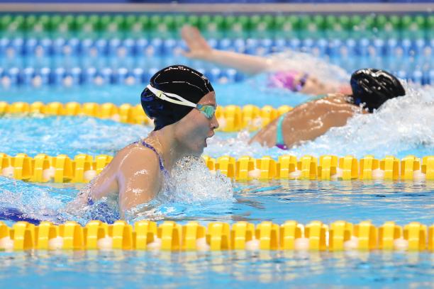 Amilova Fotimakhon - Indonesia 2018 female Para swimmer Amilova Fotimakhon takes a breath during a breaststroke