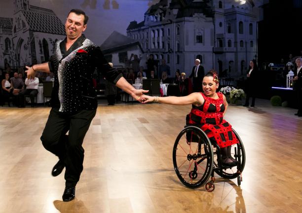 female Para dancer Helena Kasicka holding hands with her male partner during a dance