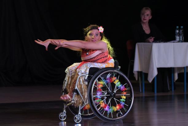 female Para dancer Julia Sadkowska stretches out her arms during a dance move
