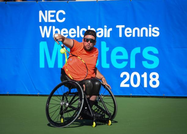 Dylan Alcott - Masters 2018 male wheelchair tennis player Dylan Alcott plays a backhand on a hard court