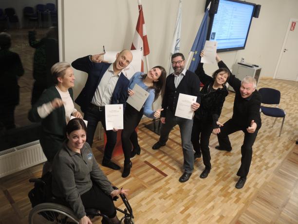 Para dance sport course - Latvia a group of Para dancers and officials giving thumbs up